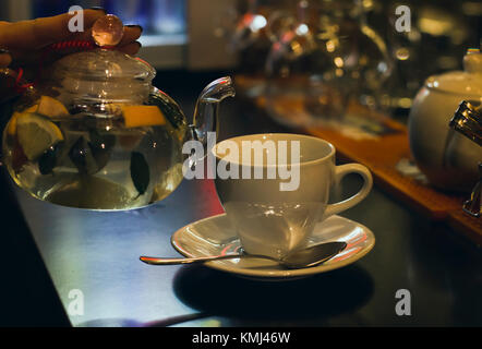 Herbal tea and Cup on the bar counter in cafe Stock Photo