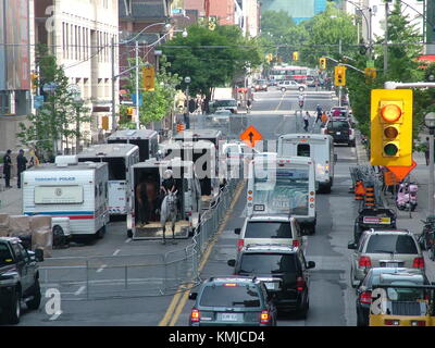 TORONTO - JUNE 23, 2010 - Police officers marching on the streets on horses during G20 Protest in Toronto, Ontario, Canada. Stock Photo