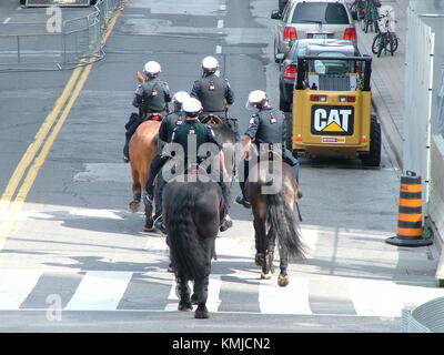 TORONTO - JUNE 23, 2010 - Police officers marching on the streets on horses during G20 Protest in Toronto, Ontario, Canada. Stock Photo