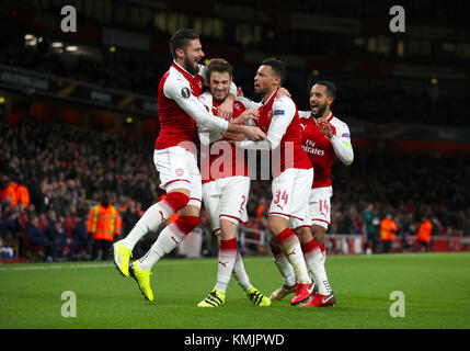 Arsenal's Mathieu Debuchy (centre) celebrates scoring his sides first ...