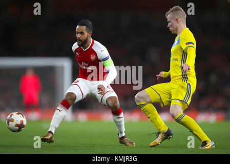 Arsenal's Theo Walcott (left) in action during the UEFA Europa League, Group H match at the Emirates Stadium, London. Stock Photo