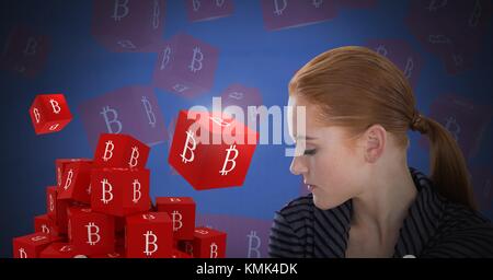 Digital composite of Bitcoin icon symbols and Businesswoman with eyes closed and dark background Stock Photo