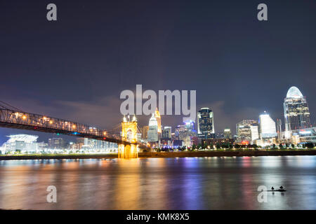 Skyline of Cincinnati, Ohio and the John A Roebling Suspension Bridge from George Rogers Clark Park in Covington, Kentucky Stock Photo