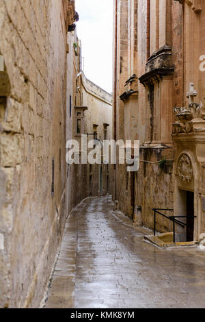 Narrow street in heavy rain, Mdina, Malta Stock Photo