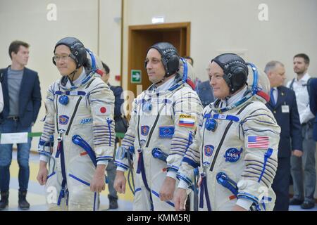 NASA International Space Station Expedition 54-55 prime crew members (L-R) Japanese astronaut Norishige Kanai of the Japan Aerospace Exploration Agency (JAXA), Russian cosmonaut Anton Shkaplerov of Roscosmos, and American astronaut Scott Tingle participate in pre-launch final qualification exams at the Gagarin Cosmonaut Training Center November 29, 2017 in Star City, Russia.   (photo by Elizabeth Weissinger via Planetpix) Stock Photo