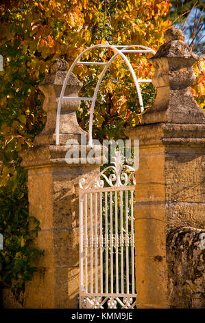 Ornate entrance gates to village house, Cazals, France