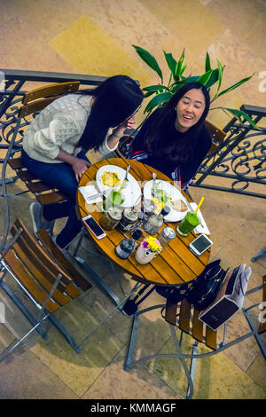 Two Young Women dining, Pacific Place, Hong Kong Stock Photo