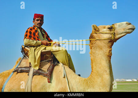 Camel shepherd who kindly let me take his photo while his camels were grazing. Al Lith region just outside of Mecca, Saudi Arabia. Stock Photo