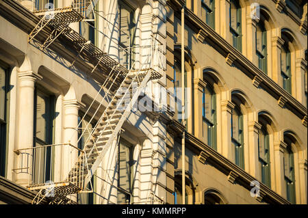 Architectural detail view of traditional fire escapes in the Cast Iron Historic District of SoHo, in downtown Manhattan, New York City Stock Photo