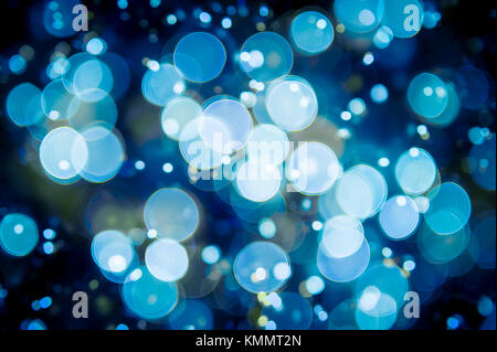 Winter holiday background in an abstract defocus ice blue bokeh