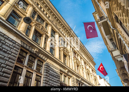 Turkish flags hanging and waving on a stone ancient building.ISTANBUL, TURKEY, APRIL 22, 2017 Stock Photo