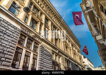 Turkish flags hanging and waving on a stone ancient building.ISTANBUL, TURKEY, APRIL 22, 2017 Stock Photo