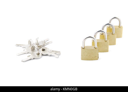 closed golden padlocks with keys isolated on white background Stock Photo