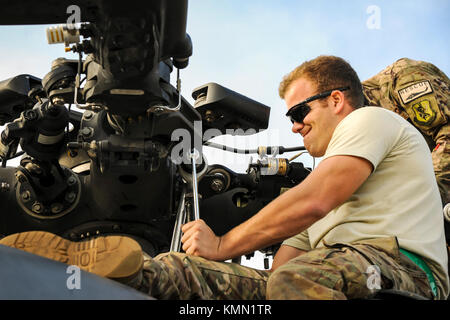 Staff Sgt. Justin Willis, 723d Aircraft Maintenance Squadron crew chief, tightens a screw on the rotor of an HH-60G Pave Hawk, Dec. 5, 2017, at Moody Air Force Base, Ga. As part of a Phase 1, Phase 2 exercise, the 23d Wing is evaluating its operations, maintenance and logistics to determine its readiness to rapidly deploy. Airmen from the 723d Aircraft Maintenance Squadron folded the main and tail rotor blades inward to make it easier to transport and then unfolded the rotors to practice making the helicopter operational. (U.S. Air Force Stock Photo