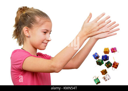 The girl throws miniature gifts, conceptually isolated on white Stock Photo