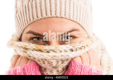 Closeup of woman smiling eyes wearing knitted scarf and hat as fashion winter clothing concept Stock Photo