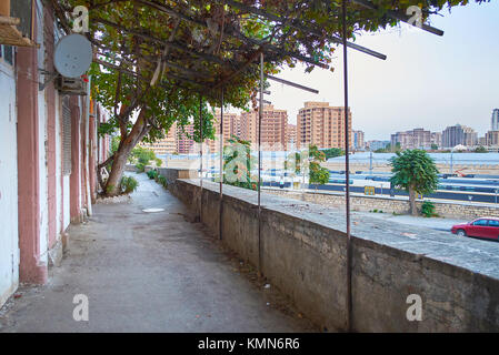 Residential shady courtyard with great view on railway station of Baku, Azerbaijan Stock Photo