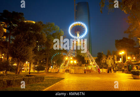 BAKU, AZERBAIJAN - OCTOBER 9, 2017: Amusement Park with bright illumination is a very popular place in the evening among locals, on October 9 in Baku Stock Photo
