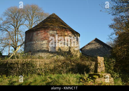 Round country barn with conical roof Stock Photo