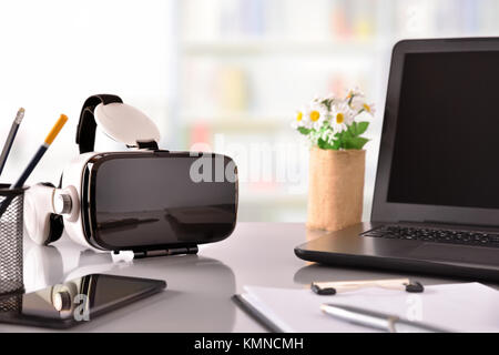 Black and white virtual reality glasses on business office table. Horizontal composition. Front view Stock Photo
