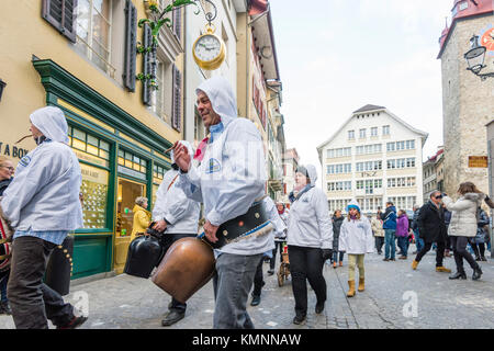 Lucerne, Switzerland - 2 Dec 2017: A group of traditional 'Trychler' men are striking their huge cowbells during the traditional Christmas parade. Stock Photo