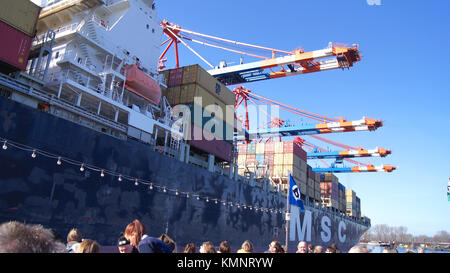 HAMBURG, GERMANY - MARCH 8th, 2014: View of the Eurokai and Burchardkai of the Hamburg harbor. There, the container vessel MSC Rachel is loaded during a clear blue sky day Stock Photo