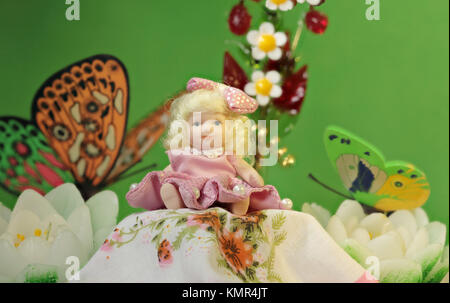 Thumbelina girl among the flowers and butterflies Stock Photo