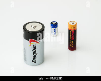 Group of three popular batteries in various sizes (D, 4LR44 and AA), isolated on white background Stock Photo
