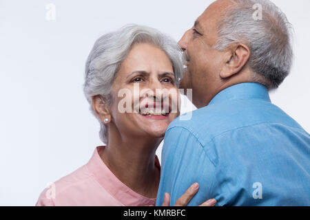 Close up of older couple embracing each other Stock Photo