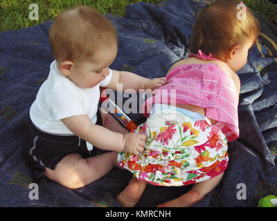 Toddler boy pulling pants off Toddler Girl Stock Photo - Alamy