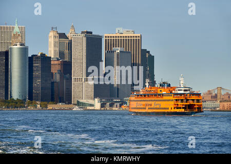 Financial District skyscrapers and the Staten Island Ferry. Lower Manhattan, New York City Harbor Stock Photo