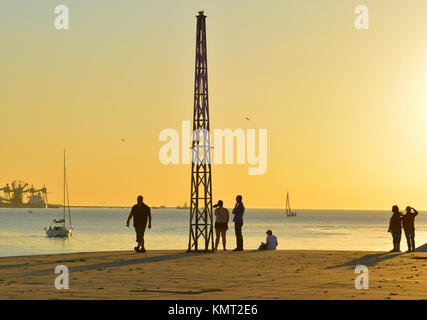 Recreation time at the sunset along the Tagus River, in the civil parish of Santa Maria de Belem in Lisbon, Portugal Stock Photo