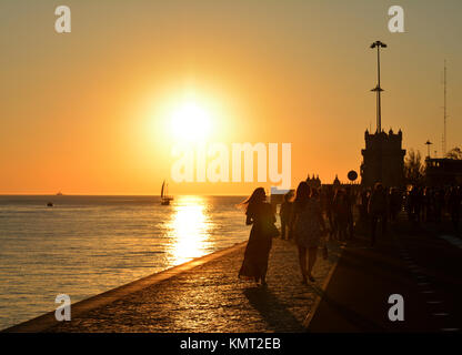 Recreation time at the sunset along the Tagus River, in the civil parish of Santa Maria de Belem in Lisbon, Portugal Stock Photo