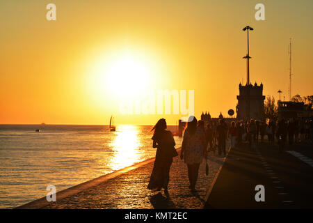 Recreation time at the sunset along the Tagus River, in the civil parish of Santa Maria de Belem in Lisbon, Portugal Stock Photo