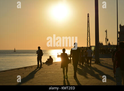 Recreation time at the sunset along the Tagus River, in the civil parish of Santa Maria de Belem in Lisbon, Portugal Stock Photo