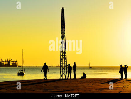 Recreation time at the sunset along the Tagus River, in the civil parish of Santa Maria de Belem in Lisbon, Portugal Stock Photo