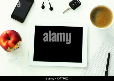 Tablet computer lying on the table at workplace Stock Photo