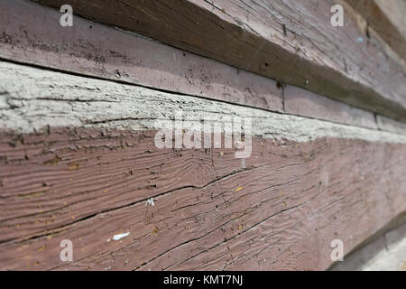Wooden logs of an old wooden house are shown close up from the perspective of an angle. It is seen in Zakopane in Poland Stock Photo