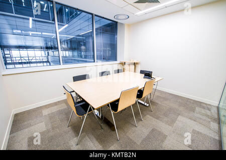 Empty small meeting room. Bright modern interior. Glass walls Stock Photo