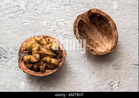 Walnuts in their Shells on White Background Stock Photo