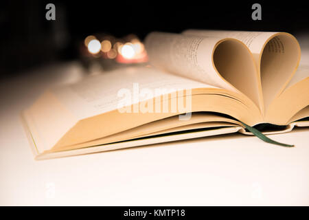 Pages of Book Folded In Shape of Heart Stock Photo