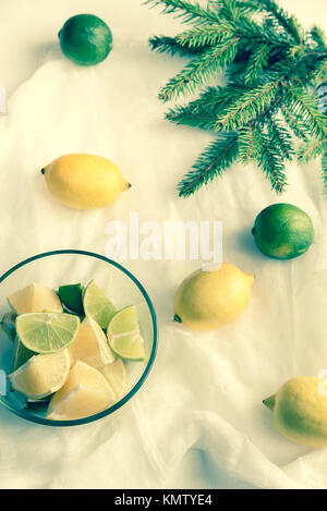 Lemons and limes on the white background Stock Photo