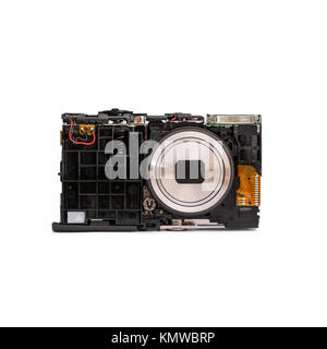 Disassembled digital camera. Details of the broken camera isolated on white background. Repair of photographic technique. Stock Photo
