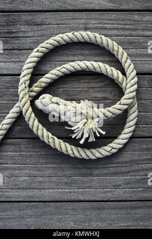 marine rope gray aged teak wood background