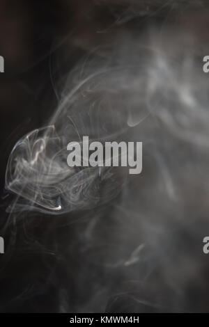 Black and White Background - White Smoke Creating a Random Shapes on Black Background Stock Photo