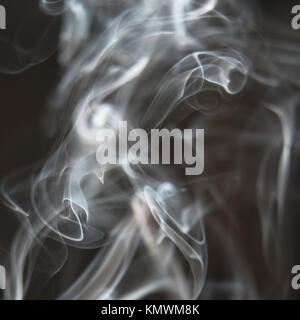 Black and White Background - White Smoke Creating a Random Shapes on Black Background Stock Photo