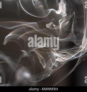 Black and White Background - White Smoke Creating a Random Shapes on Black Background Stock Photo