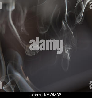 Black and White Background - White Smoke Creating a Random Shapes on Black Background Stock Photo