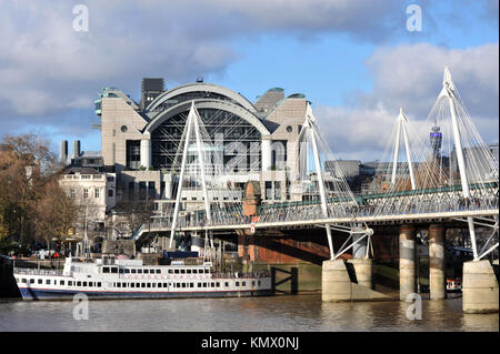 London, UK, 08/12/2017 Charing Cross X station and Hungerford Bridge taken from the South Bank of the Thames. Stock Photo