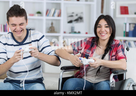 teenagers playing video game Stock Photo